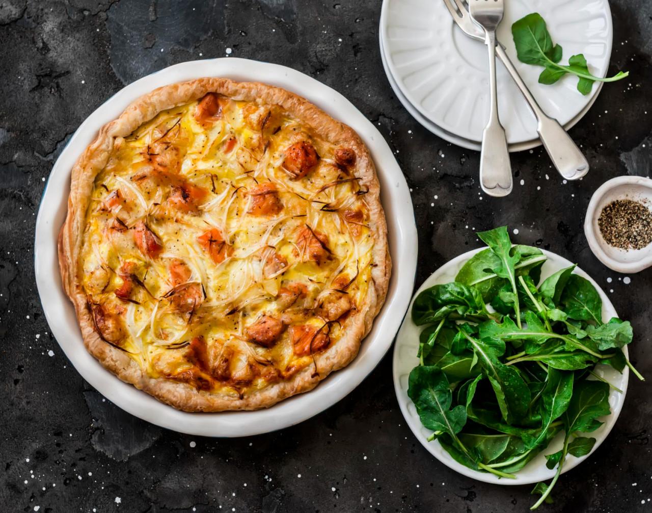 smoked trout potatoes leek pie dark background top view